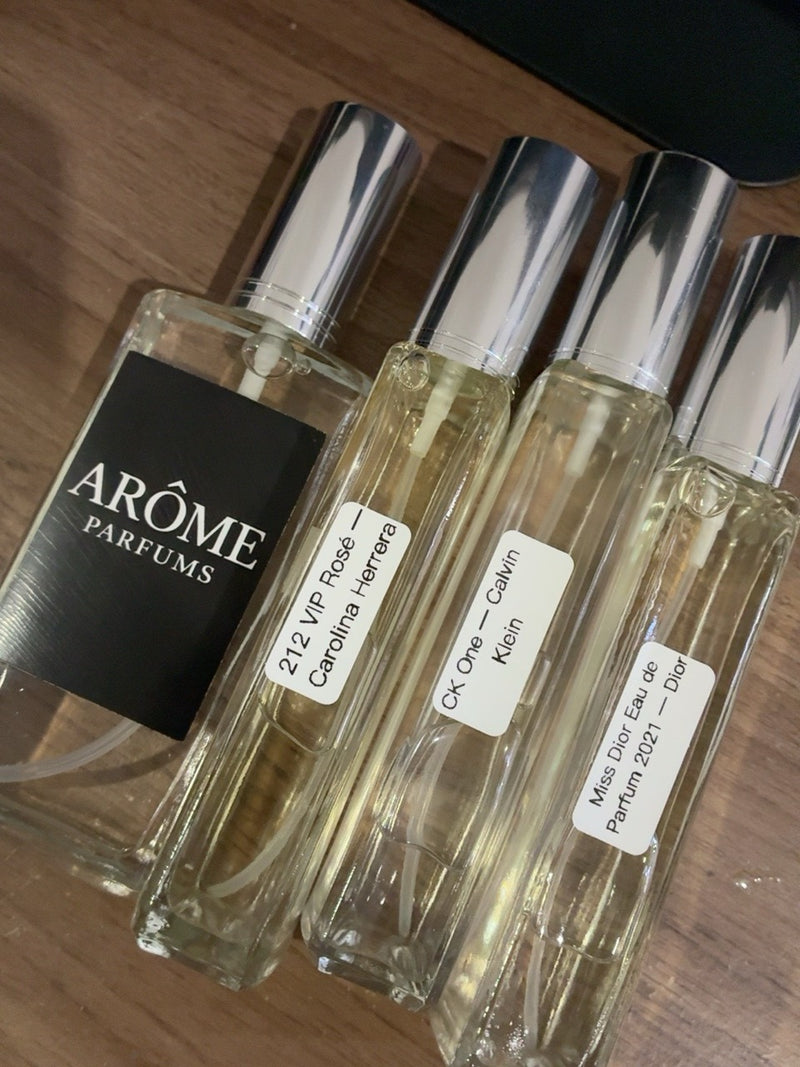 Fotografía real de perfumes y presentación ARÔME proporcionada por la tienda